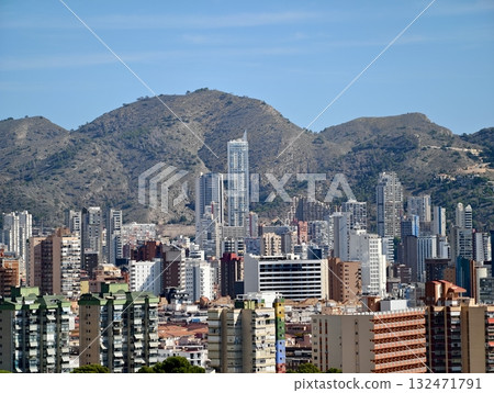 luminous skyline with diverse architecture reflected in tranquil waters during lively nocturnal 132471791