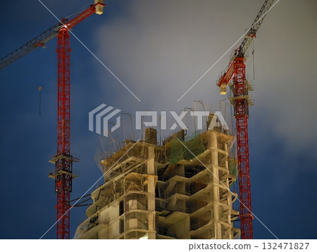 luminous skyline with diverse architecture reflected in tranquil waters during lively nocturnal 132471827