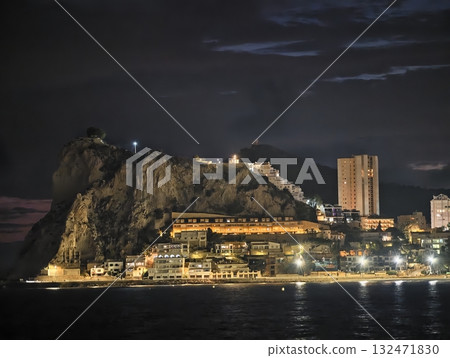 luminous skyline with diverse architecture reflected in tranquil waters during lively nocturnal 132471830