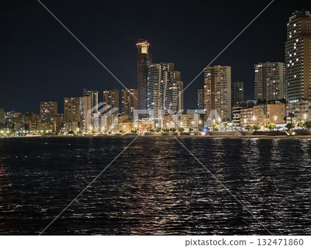 luminous skyline with diverse architecture reflected in tranquil waters during lively luminous skyline with diverse architecture reflected in tranquil waters during lively 132471860