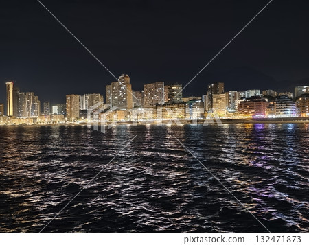 luminous skyline with diverse architecture reflected in tranquil waters during lively nocturnal luminous skyline with diverse architecture reflected in tranquil waters during lively nocturnal 132471873