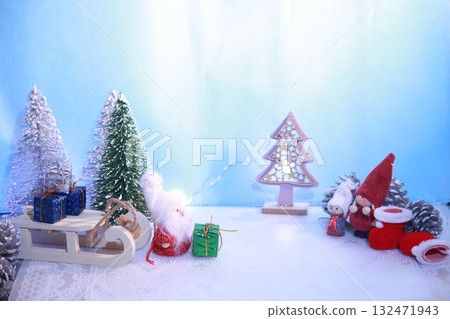 Santa Claus in a sleigh with Christmas trees and presents on the snow 132471943