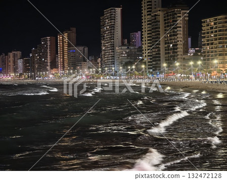 restless ocean waves crash by city skyline, neonlit high rises create vibrant waterfront night restless ocean waves crash by city skyline, neonlit high rises create vibrant waterfront night 132472128