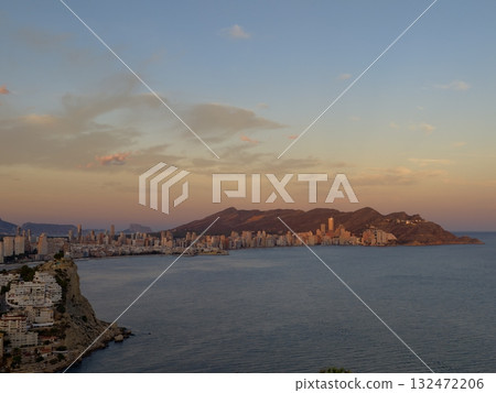peaceful coastal view with pastel skies reflected, calm bay at dusk with distant peaks peaceful coastal view with pastel skies reflected, calm bay at dusk with distant peaks 132472206