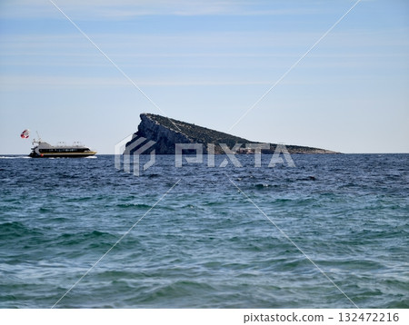 marine survey underway, environmental monitoring ship navigates rocky terrain under clear daylight 132472216
