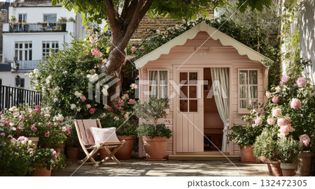Kawaii charming pink garden shed surrounded by blooming flowers and cozy wooden chairs creates peaceful and inviting outdoor space 132472305