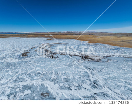 Tibetan Yaks walking on frozen lake in tibet, China Tibetan Yaks walking on frozen lake in tibet, China 132474286