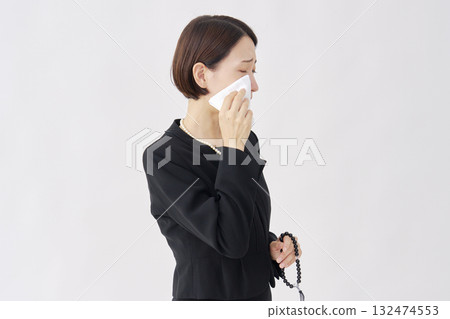 Woman in mourning clothes crying white background Woman in mourning clothes crying white background 132474553