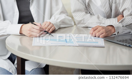 Asian couple considering insurance Asian couple considering insurance 132476694