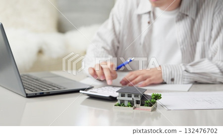 Asian man considering real estate 132476702