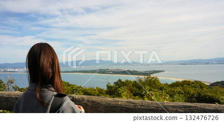 A moment to gaze at the sea 132476726