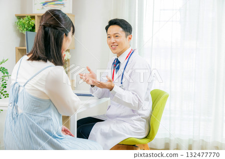 Doctor examining a patient 132477770