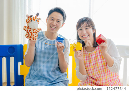 Children and nursery teachers playing at nursery school 132477844