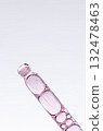 Skin serum in a pipette. A cosmetic product for body care. White background. Copy space 132478463