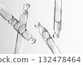 Skin serum in a pipette. A cosmetic product for body care. White background. 132478464