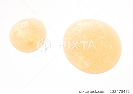 Yellow cosmetic product. Face serum or cleanser gel or body moisturizing gel. Yellow cosmetic product. Face serum or cleanser gel or body moisturizing gel. 132478471