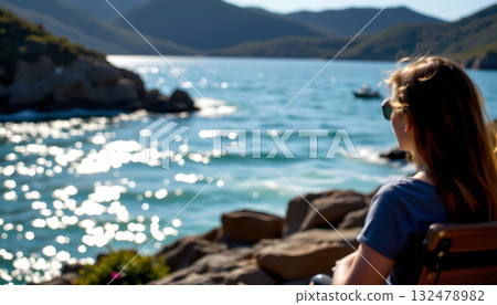 Two contrasting views of water  one, an expansive body of deep blue water with small ripples, offering an up close perspective 132478982