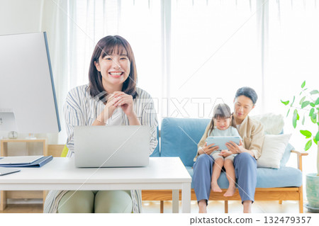 mom and family working at home mom and family working at home 132479357