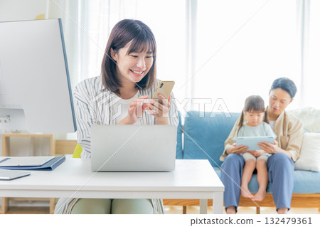 mom and family working at home mom and family working at home 132479361
