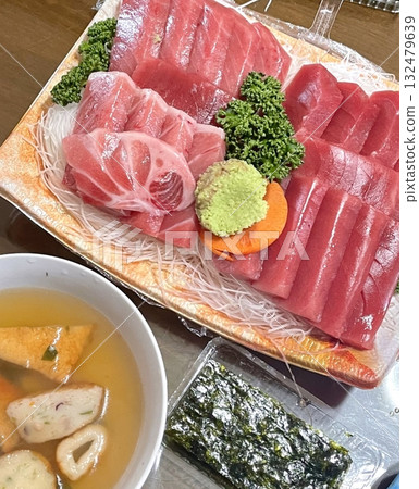 Fresh and delicate sashimi slices, beautifully presented with vibrant colors and perfect cuts. This traditional Japanese delicacy highlights the pure flavors of premium seafood. Fresh and delicate sashimi slices, beautifully presented with vibrant colors and perfect cuts. This traditional Japanese delicacy highlights the pure flavors of premium seafood. 132479639