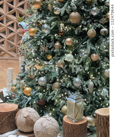 A beautifully decorated Christmas tree with twinkling lights, colorful ornaments, and a star on top. A symbol of warmth and joy, perfect for celebrating the holiday season. A beautifully decorated Christmas tree with twinkling lights, colorful ornaments, and a star on top. A symbol of warmth and joy, perfect for celebrating the holiday season. 132479644