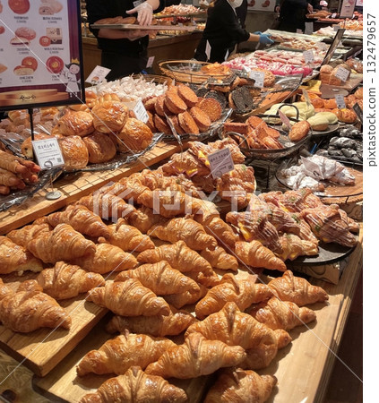 Beautiful and delicious pastries displayed in a bakery, with colorful glazes, delicate toppings, and tempting textures—offering a perfect visual feast of sweetness and artisanal charm. Beautiful and delicious pastries displayed in a bakery, with colorful glazes, delicate toppings, and tempting textures—offering a perfect visual feast of sweetness and artisanal charm. 132479657