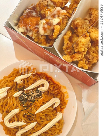 Crispy Korean fried chicken with sweet and spicy glaze paired with fiery buldakmyeon noodles, offering a perfect explosion of bold heat, rich flavor, and satisfying crunch in every bite. Crispy Korean fried chicken with sweet and spicy glaze paired with fiery buldakmyeon noodles, offering a perfect explosion of bold heat, rich flavor, and satisfying crunch in every bite. 132479659