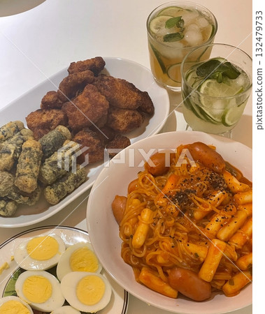 Bunsik, a popular Korean street food, features comforting and savory dishes like tteokbokki (spicy rice cakes), odeng (fish cake skewers), and kimbap (seaweed rice rolls). Perfect for quick meals. Bunsik, a popular Korean street food, features comforting and savory dishes like tteokbokki (spicy rice cakes), odeng (fish cake skewers), and kimbap (seaweed rice rolls). Perfect for quick meals. 132479733