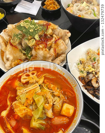 Spicy and numbing malatang with a mix of fresh ingredients in rich Sichuan broth, paired with crispy and tangy guobaorou. A perfect balance of bold heat and sweet-sour crunch for a Chinese feast. 132479739