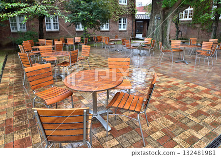 Wet tables and chairs on a rainy day on campus Wet tables and chairs on a rainy day on campus 132481981