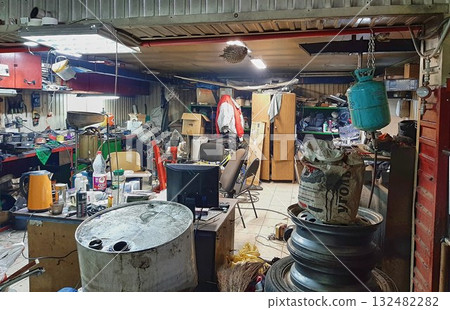 A mess in the workshop, an unorganized garage. A mess in the workshop, an unorganized garage. 132482282