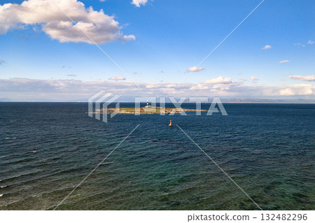 Omazaki, Benten Island, Omazaki Lighthouse, and a view of Hokkaido across the shore. Oma Town, Aomori Prefecture (aerial photo taken by drone) Omazaki, Benten Island, Omazaki Lighthouse, and a view of Hokkaido across the shore. Oma Town, Aomori Prefecture (aerial photo taken by drone) 132482296