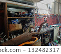 A mess in the workshop, an unorganized garage. 132482317