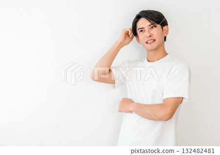 A young Asian man thinking in trouble (worried, worried, what to do, trouble, doubt) A young Asian man thinking in trouble (worried, worried, what to do, trouble, doubt) 132482481