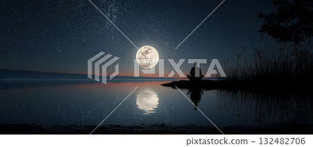 Silhouette of a man meditating by a calm lake under a full moon at night 132482706