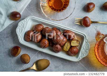 Chestnuts simmered in their skins | A refined dessert with the aroma of syrup Chestnuts simmered in their skins | A refined dessert with the aroma of syrup 132482779