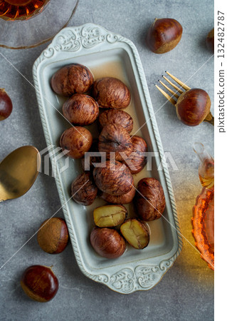 Chestnuts simmered in their skins | A refined dessert with the aroma of syrup Chestnuts simmered in their skins | A refined dessert with the aroma of syrup 132482787