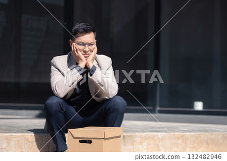 Concept of business failure and unemployment problem, unemployment stress businessman sitting on stairs. Concept of business failure and unemployment problem, unemployment stress businessman sitting on stairs. 132482946