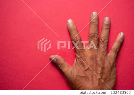 Hands on a red background Hands on a red background 132483503