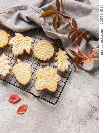 Autumn cookies baking tradition with fall leaves shapes 132484055