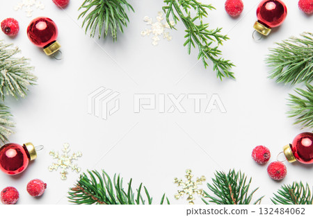 Christmas frame with fir branches and red ornaments 132484062