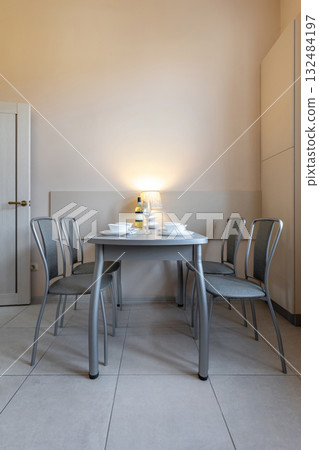 Modern Minimalist Dining Room with Lamp and Table Setting Modern Minimalist Dining Room with Lamp and Table Setting 132484197