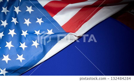 Closeup view of the American flag with colored background. Copy space. American holiday backdrop 132484284