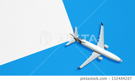 Airplane with a split blue and white background. Template or Copy space. Concept of travel, tourism or aviation. Flat lay style 132484287