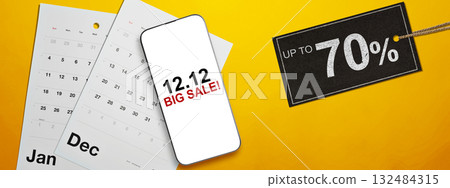 12.12 big sale text on cellphone screen with up to 70% text on the label tag. Copy space. Flash sale concept 132484315