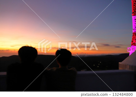 View from the summit observation deck of Mt. Inasa: sunset sky, boy 132484800
