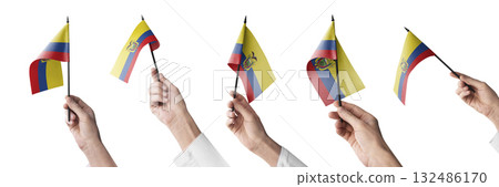 The Ecuador flag in hand in different angles on a white background 132486170