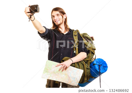 Man tourist backpacker taking photo with camera. Man tourist backpacker taking photo with camera. 132486692