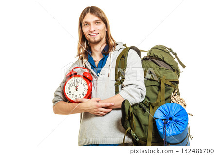 Travel time season. Man backpacker holding clock. Travel time season. Man backpacker holding clock. 132486700