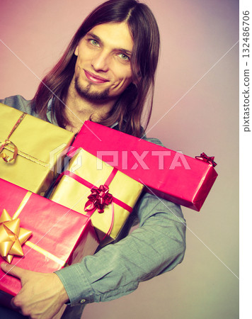 Guy with many presents gift boxes 132486706